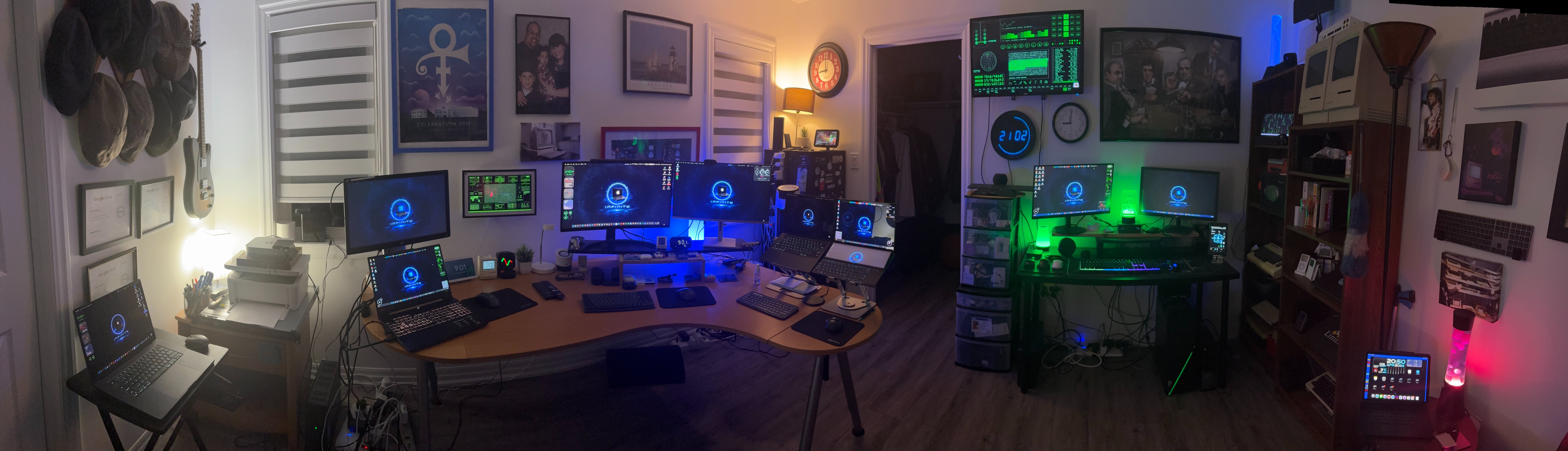 Rob's command center home lab — panoramic view of multiple monitors, servers, and retro tech in Keswick, Ontario